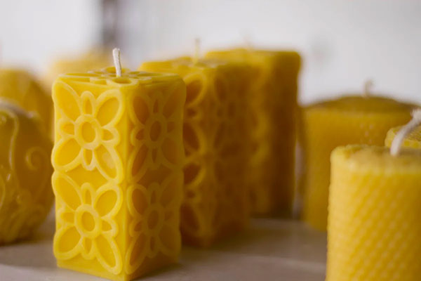 Beeswax candles with a textured flower patern