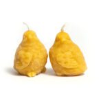 Beeswax candle in the shape of a round fluffy bird.