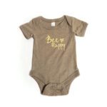 Muted brown baby onesie with yellow text reading "Bee Happy" and a small bee graphic.