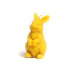 Beeswax candle in the shape of a cute bunny standing on its hind legs.